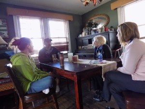 Social worker Tracy's(far right)working on her best reflection skills. Nurse extraordinaire Mary Ann's examining the patient with a clinical eye.